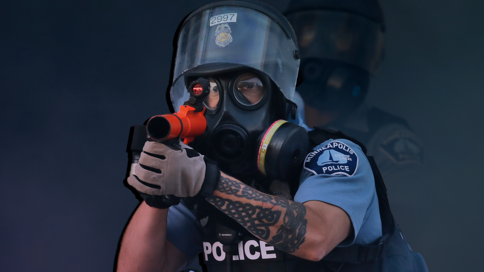 A police officer fires tear gas at protesters during a demonstration in St. Paul, Minn, in 2020.